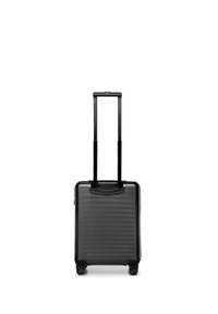 Black hard-shell suitcase with telescopic handle extended and four spinner wheels on a white background.