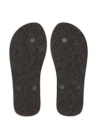 Musta flip-flop pohjat, joissa on geometrinen kuviointi, näyttäen kolme pyöreää tulpaa jokaisessa pohjassa valkoista taustaa vasten.