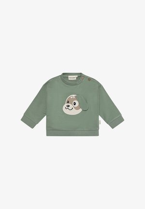 Grøn bomuldssweatshirt med påsyet hundefjæs på forsiden, rund hals og to træknapper på skulderen for nem påklædning.