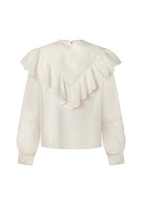 Vit blus med volang i ryggens yoke, långa ärmar med texturerade detaljer och en knäppning vid halsen. Slät tyg.