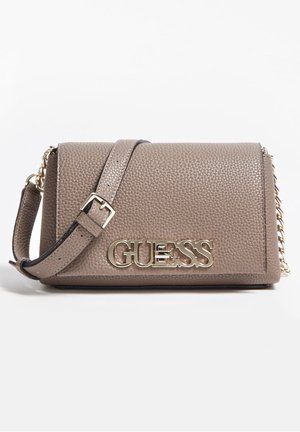 Taupe textured leather shoulder bag with gold chain strap and large gold "GUESS" logo on front flap.