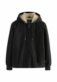 Sudadera negra con cremallera en la parte delantera, capucha con cordón y forro de felpa color crema. Cuenta con bolsillos laterales y puños elásticos.