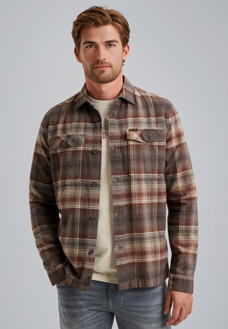 Ruitvormig flanellen shirt in bruin, crème en roestkleur, met een knoopsluiting, twee borstzakken en een relaxte pasvorm.