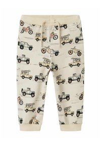 Helle beige Jogginghosen mit einem wiederholten Druck von verschiedenen Fahrzeugen, darunter Autos und Motorräder, mit elastischen Bündchen und einem Kordelzugbund.