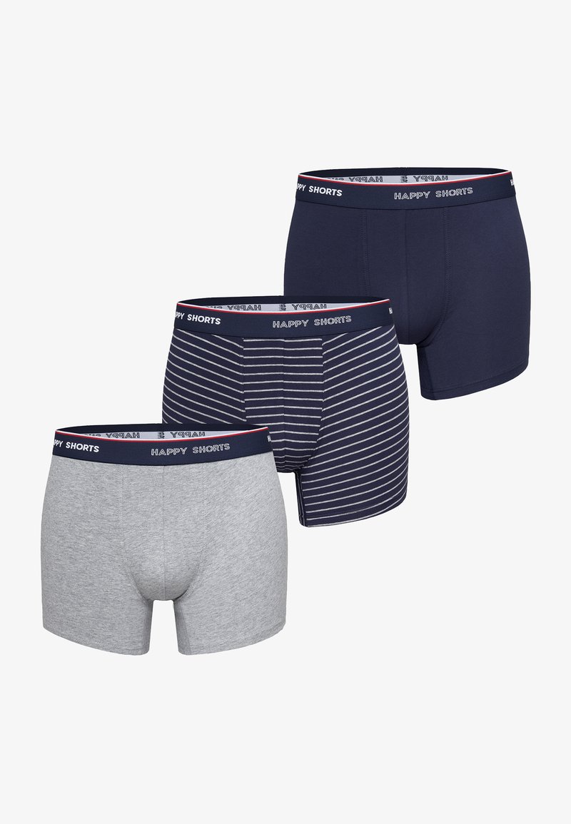 Drie paar jongens trunk ondergoed: grijs, marineblauw en marine met witte strepen. Elk heeft een gebrandmerkte elastische tailleband.