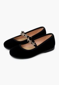 Black velvet ballet flats with a rounded toe and a strap; features five silver star-shaped accents on the strap. Smooth texture and simple design.