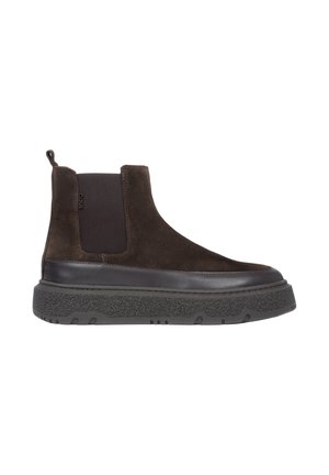 Brown suede ankle boot with elastic side panels, textured black rubber sole, and heel pull tab; modern design with a chunky silhouette.