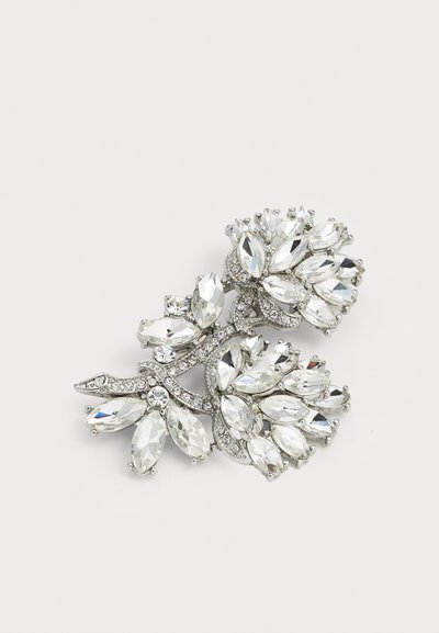 Rhinestone brooch featuring a floral design with multiple marquise-cut clear stones, set on a silver-tone metal base.