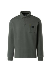 Polo a maniche lunghe verde scuro realizzato in tessuto testurizzato. Presenta un colletto con bottoni, una tasca sul petto con una zip gialla e polsini a coste.