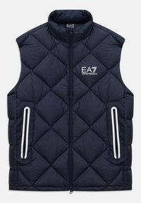 Gilet sans manches en quilté bleu marine avec fermeture éclair à l'avant, poches zippées et logo blanc EA7 Emporio Armani sur la poitrine.