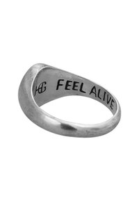 Silver ring with a smooth, curved design. Engraved inside with "FEEL ALIVE" in bold, clear lettering. Minimalist and unadorned finish.