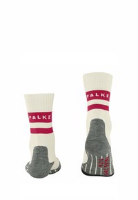 Calze lunghe fino al ginocchio con una base crema, strisce rosse con il marchio "FALKE" e una suola grigia texturizzata per aderenza e comfort.