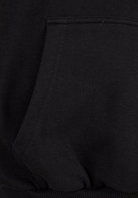 Black sweatshirt fabric with smooth texture, featuring a kangaroo pocket and ribbed hem. No visible patterns or hardware accents.