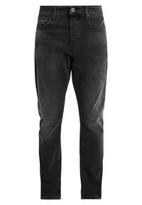 Vaqueros de mezclilla negros con ajuste ceñido, cierre de botones, diseño de cinco bolsillos, detalles sutilmente desgastados y una textura suave.