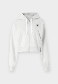 Grey cropped hoodie made of soft fabric, featuring a front zipper, white drawstrings, and a circular logo patch on the left chest.