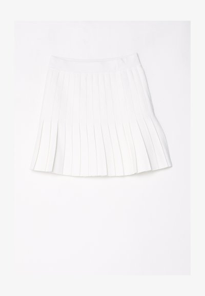 Jupe plissée blanche avec une large ceinture, présentée à plat sur un fond blanc.