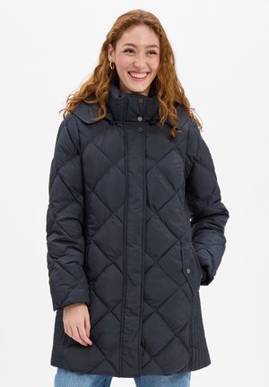 Dark navy padded coat with diamond quilt pattern, high collar, snap closure, and side pockets, featuring long sleeves and a textured design.