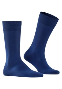Calcetines azul marino hechos de una tela suave, con un puño acanalado. El diseño es simple, con una puntera sin costuras y un talón reforzado.