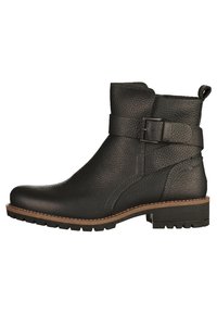 Bottine en cuir noir avec une finition texturée, détail de boucle sur le côté et une semelle basse crantée. Accents marron cousus le long du bord.