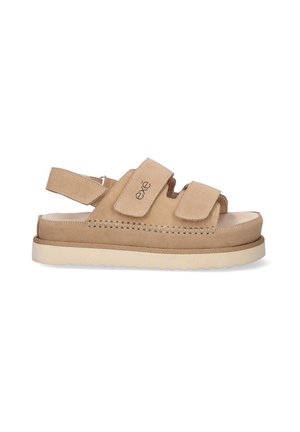 Sandalias de ante beige con correas ajustables de gancho y bucle, plantilla acolchada y suela gruesa texturizada para un mejor agarre y comodidad.