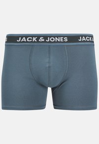 Caleçons boxers pour hommes en bleu ardoise uni, avec une taille noire portant le logo "JACK & JONES" en blanc. Texture de tissu lisse, design ajusté.