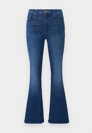 Blue denim jeans with high waist and flared legs, featuring front pockets, copper buttons, and a visible zipper fly.