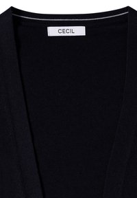 Schwarzer Cardigan mit V-Ausschnitt, hergestellt aus einem strukturierten Strickstoff. Verfügt über ein dezentes Streifendesign im Bereich des Ausschnitts. Etikett: CECIL.