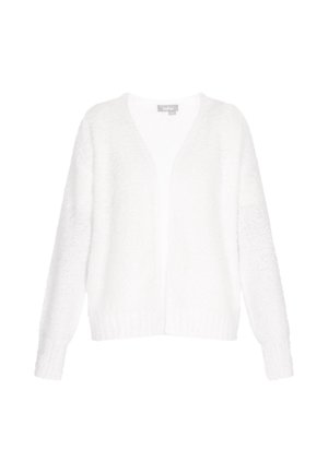 Balta adīta jaka ar V veida kakla un garām piedurknēm. Tai ir teksturēta auduma raksts un ribota apakšmala, radot mīkstu slāņainu izskatu.