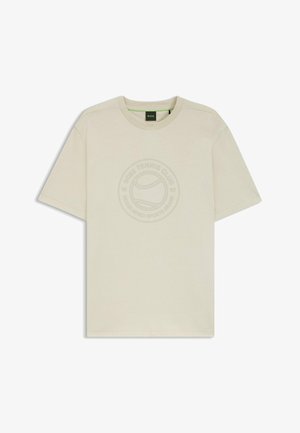 Beige katoenen t-shirt met een ronde hals, korte mouwen en een tonale logografiek op de voorkant met een tennisbalmotief.