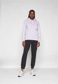 Champion ICONS CUFF PANTS LARGE LOGO - Tréningruha alsók - black