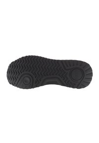 Sole in gomma nera con pattern a zigzag testurizzato, dettagli circolari e bordi definiti per trazione e durata.