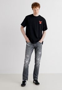 Levi's® VINTAGE FIT GRAPHIC - Apdrukāts T-krekls - black'