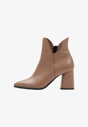 Brown leather ankle boot with a pointed toe and a mid-height block heel. Features a V-cut opening at the ankle for easy wear.