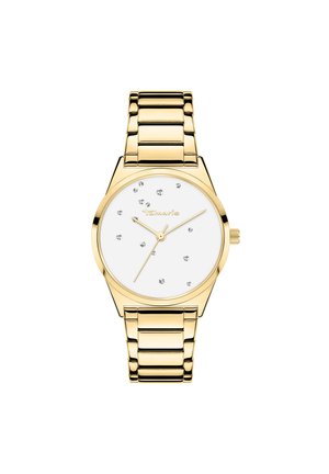 Montre en acier doré avec un bracelet en maillons métalliques, un cadran blanc et des marqueurs d'heure à clous. Présente un boîtier rond et des aiguilles fines.