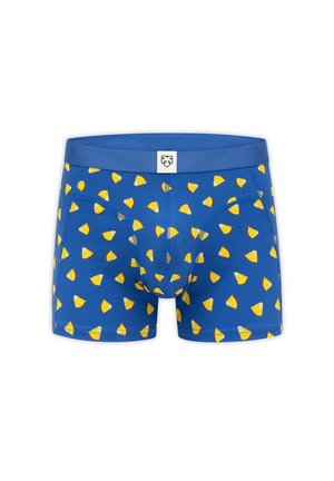 Blaue Boxershorts mit gelbem, dreieckigem Fruchtscheibenmuster und einem kleinen weißen Etikett mit einem stilisierten Tiergesicht am Bund.