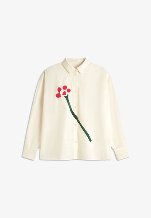 Cream button-up shirt with long sleeves featuring a red flower design and green stem on the left side. Smooth fabric, classic collar.