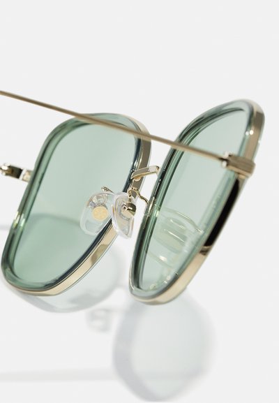 Tory Burch Solbriller - transparent green