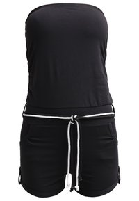 Combinaison noire sans bretelles avec ceinture à cordon blanc, deux poches avant et un style décontracté ajusté.