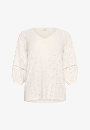 Blouse blanche avec un col en V, manches bouffantes 3/4 et détails en broderie anglaise. Tissu doux avec une texture légère. Coupe décontractée.