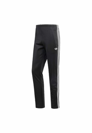 Pantaloni sportivi neri con accento a tre righe bianche sui lati, vita elastica e un piccolo logo vicino all'anca. Texture del tessuto liscia.