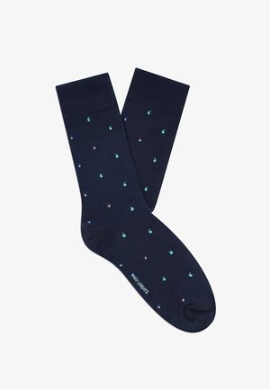 Granatowe skarpetki z małymi turkusowymi, czerwonymi i niebieskimi kropkami oraz ściągaczami, z napisem "PAUL LORENTE" w okolicy palców.