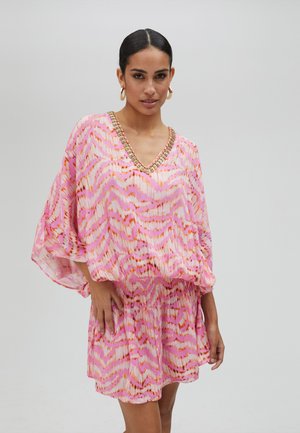 Pink patterned dress with short, loose sleeves, v-neckline, and embellishments around the neckline. Flowy fit with gathered waist.