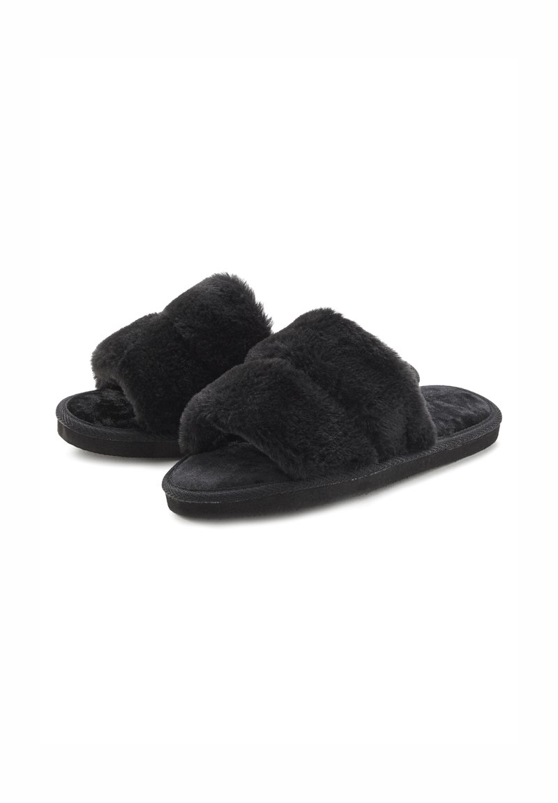 Black fur-lined slide slippers with two wide, plush straps and a textured footbed. Soft material and flat, rubber soles for indoor comfort.
