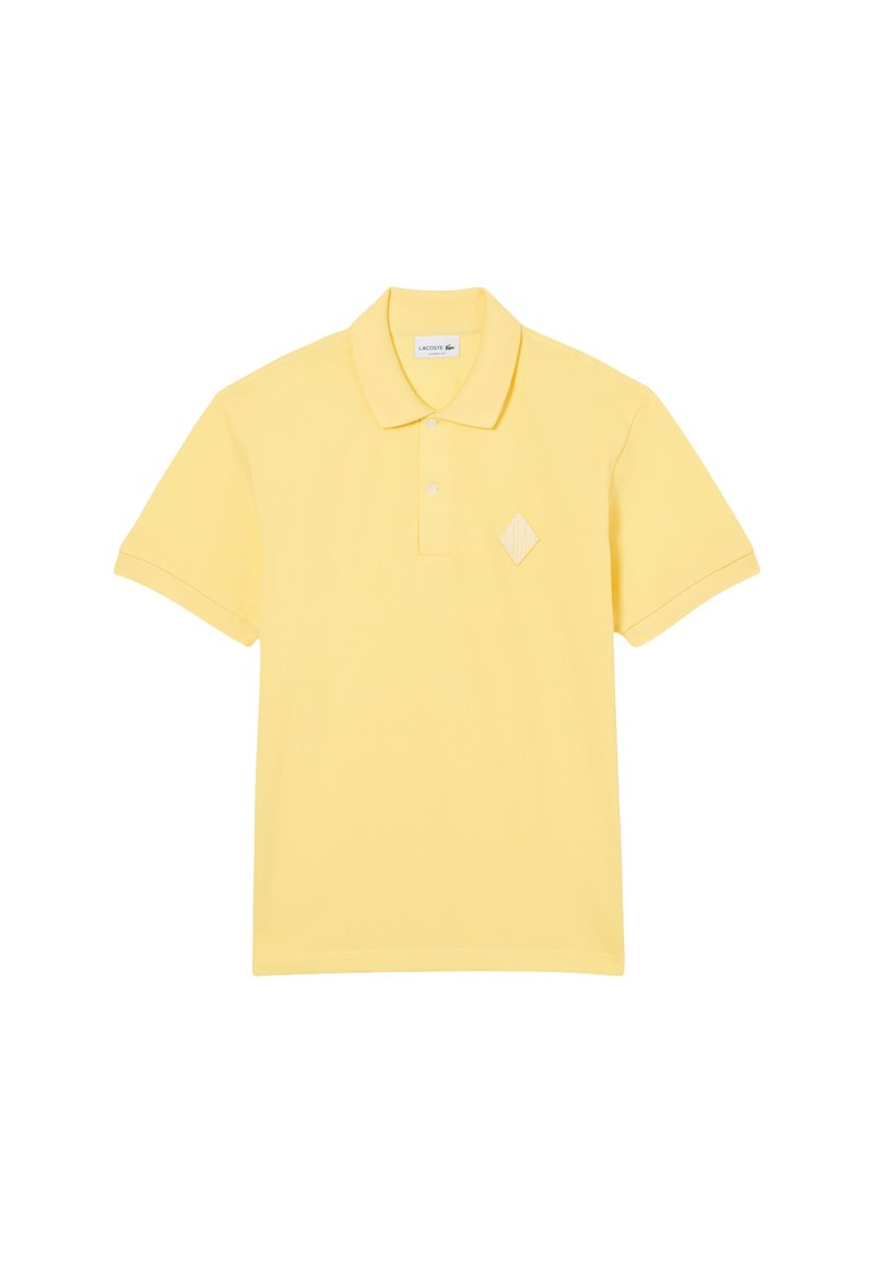 Polo gialla realizzata in tessuto strutturato, con patta con bottoni, colletto piatto e logo a diamante ricamato sul petto.