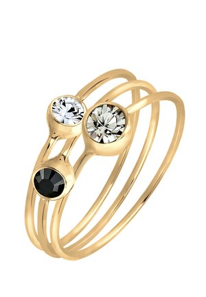Goldfarbener Ring mit drei runden Edelsteinen: zwei klare und einen schwarzen. Glatte, dünne Bänder winden sich für ein modernes Design.
