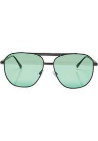Aviator-aurinkolasit vihreillä linsseillä, mustalla metallikehyksellä ja kontrastoivilla yksityiskohdilla. Mukana säädettävät nenätyynyt mukavuutta varten.