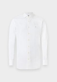 Hvit langermet skjorte laget av bomull. Har en knapp-lukking foran, spiss krage, og en liten blå brodert logo på brystet.