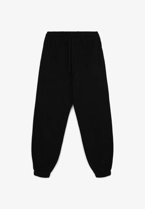 Pantaloni da jogging neri realizzati in tessuto morbido, con vita elastica e cordoncino, polsini affusolati e una superficie liscia.