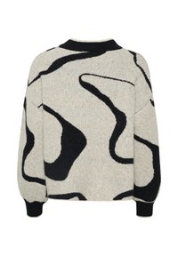 Trui met een gestructureerde crèmekleurige basis met gedurfde zwarte abstracte patronen, geribde manchetten en een ronde halslijn.