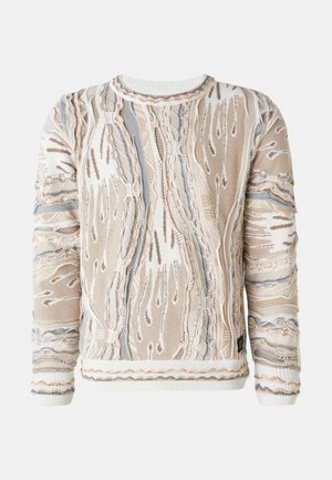 Pull texturé en beige, crème et gris. Présente des motifs élaborés, des détails en tricot et des poignets côtelés avec un col rond.